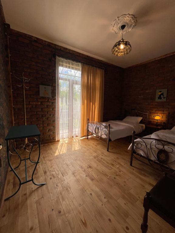 Postel nebo postele na pokoji v ubytování Odo’s Guest House