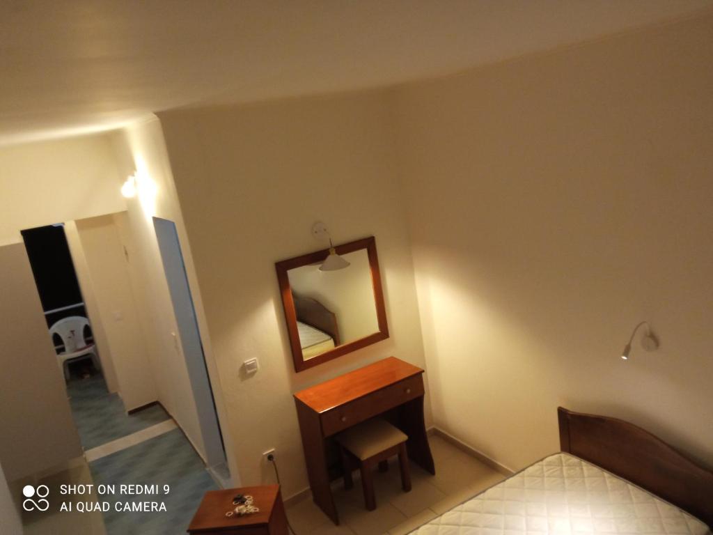 Postel nebo postele na pokoji v ubytování Aggelos Family Hotel