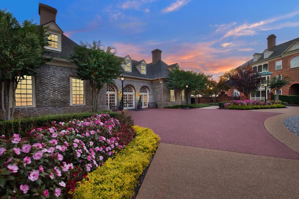 a home with flowers in front of a building at Marriott's Manor Club at Ford's Colony in Williamsburg