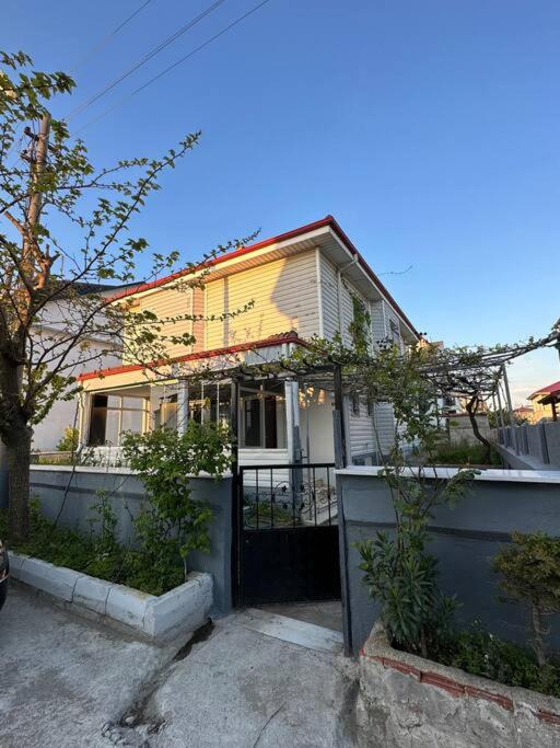 a house with a fence in front of it at Large Beachfront Villa in Natural Seaside with Sea View in Yukarı Kocaali