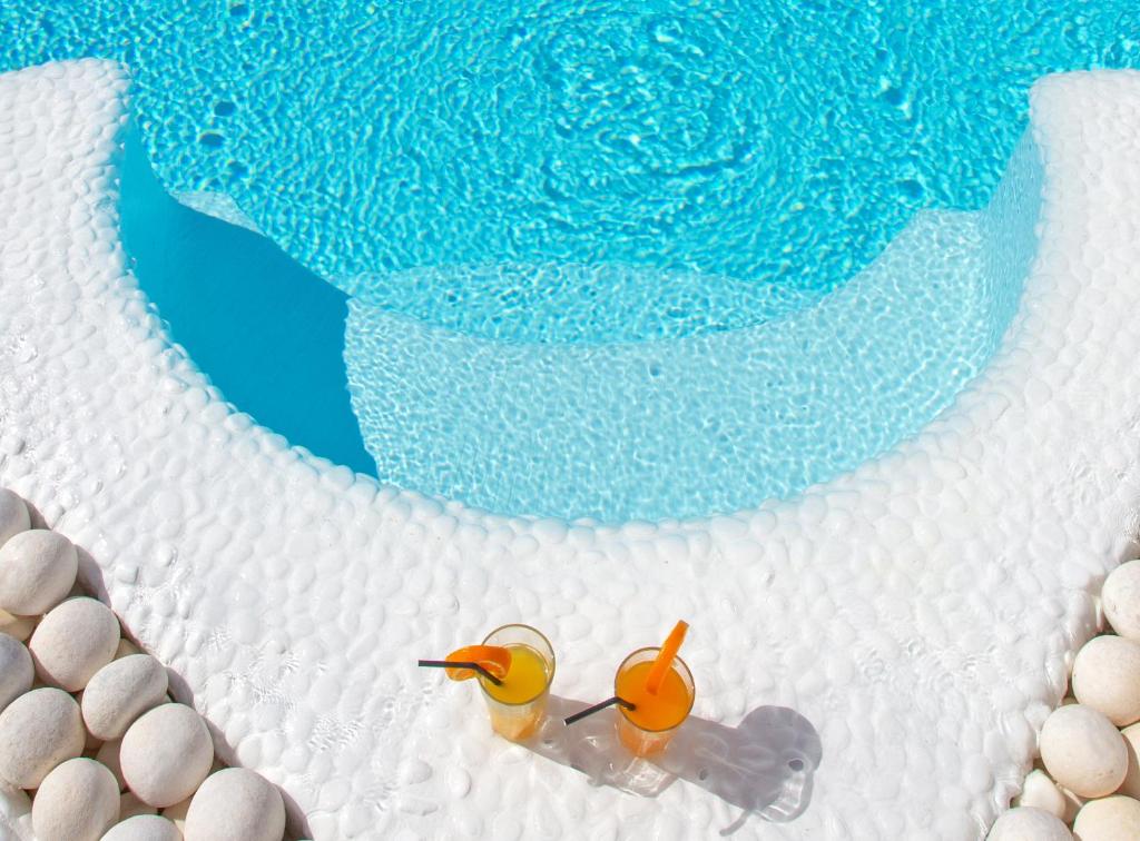 two rubber ducks are sitting on a cake at Apsenti couples only in Agios Ioannis Mykonos