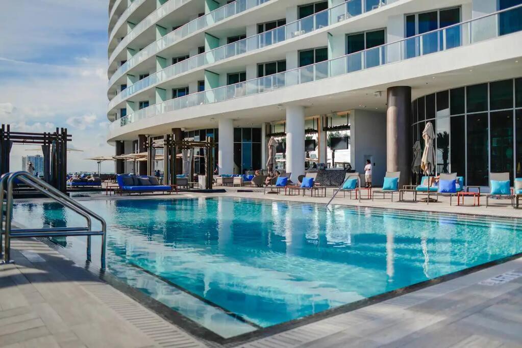 a large swimming pool in front of a hotel at Luxury Condo with Spectacular Ocean View in Hollywood