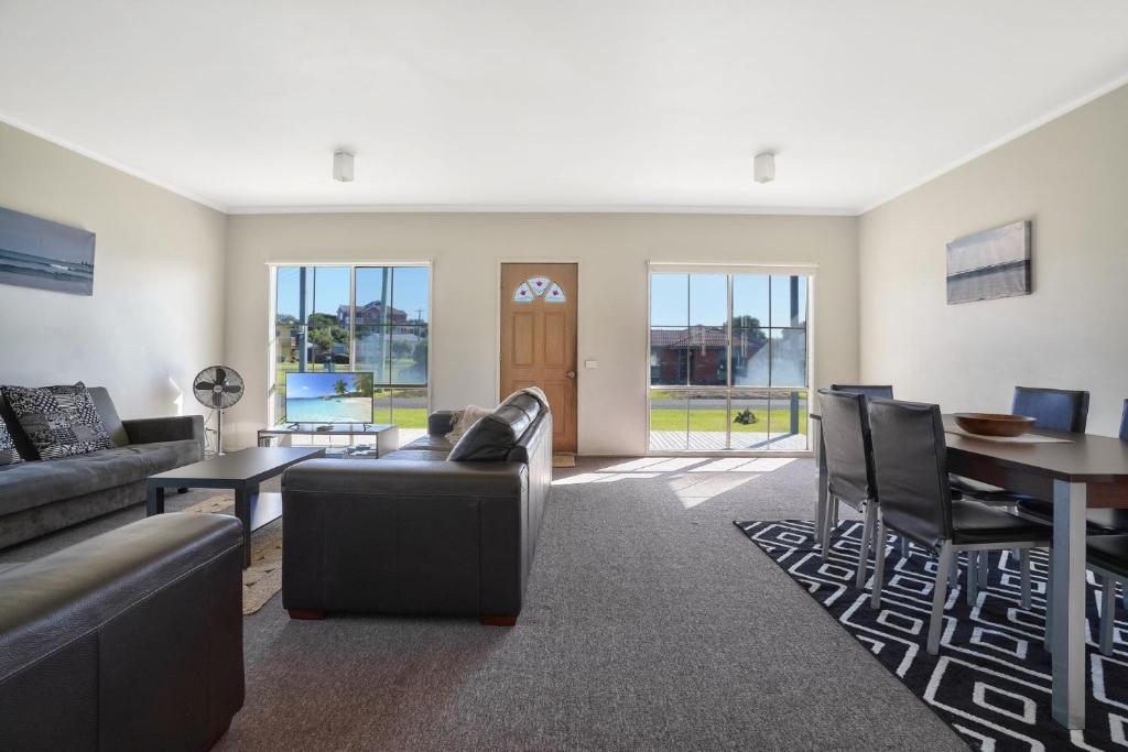 a living room with a couch and a table at Julieanne in Port Fairy