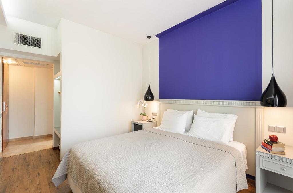 Postel nebo postele na pokoji v ubytování Hotel El Greco