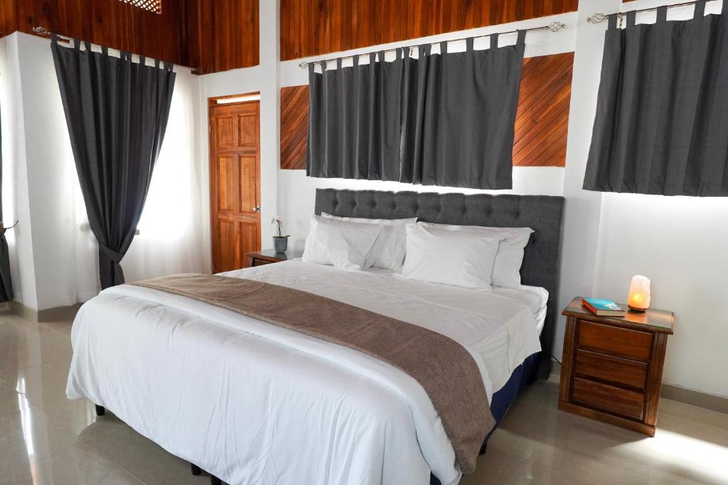 Postel nebo postele na pokoji v ubytování Hotel Ribera La Paz