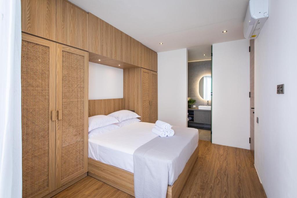 Postel nebo postele na pokoji v ubytování 20 Suites Umalas