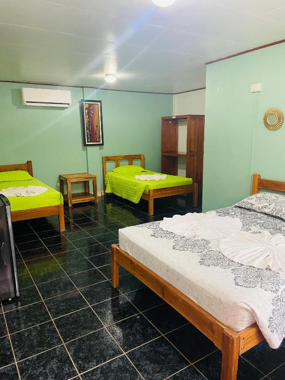 Postel nebo postele na pokoji v ubytování Hotel El Chaman