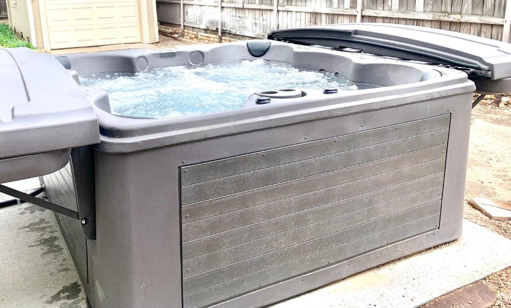 a large hot tub in a backyard at Garden City House with Hot Tub in Colorado Springs