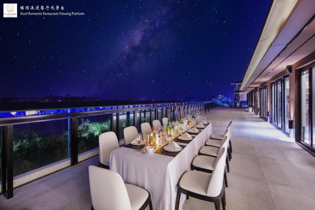 Balkón nebo terasa v ubytování Riverside Wing Hotel Guilin