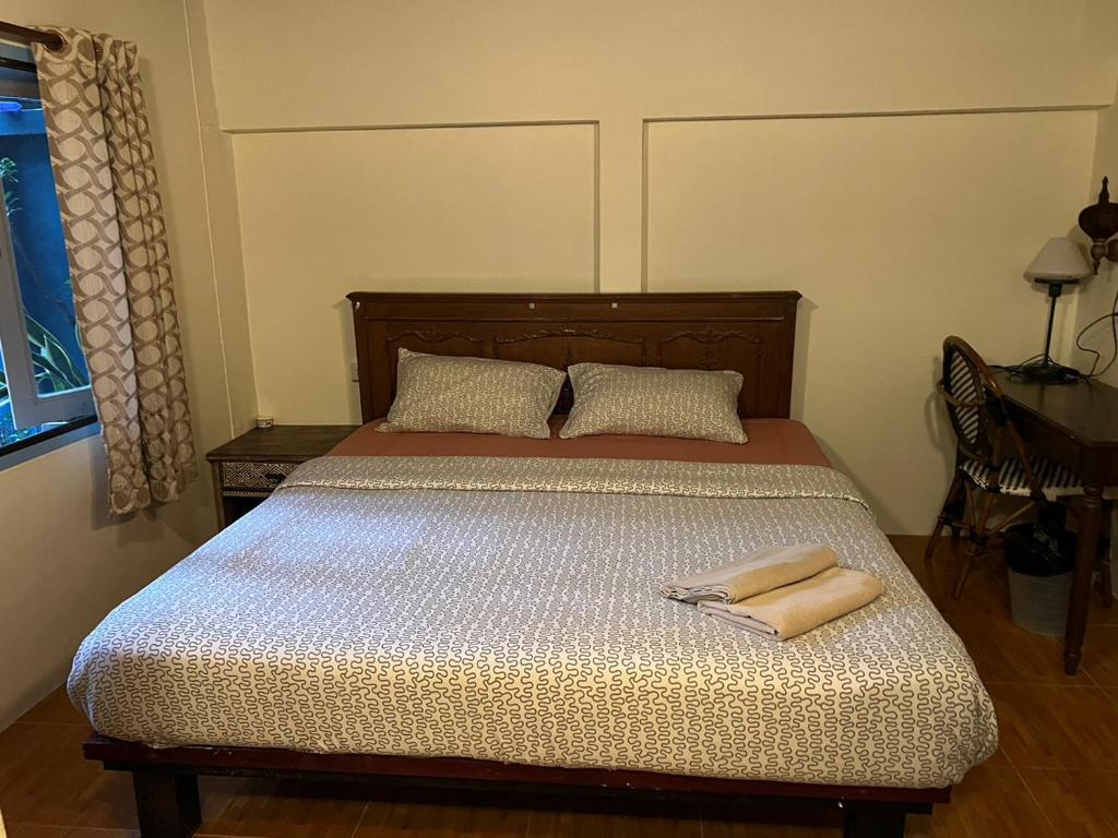 Postel nebo postele na pokoji v ubytování Blue Chang House