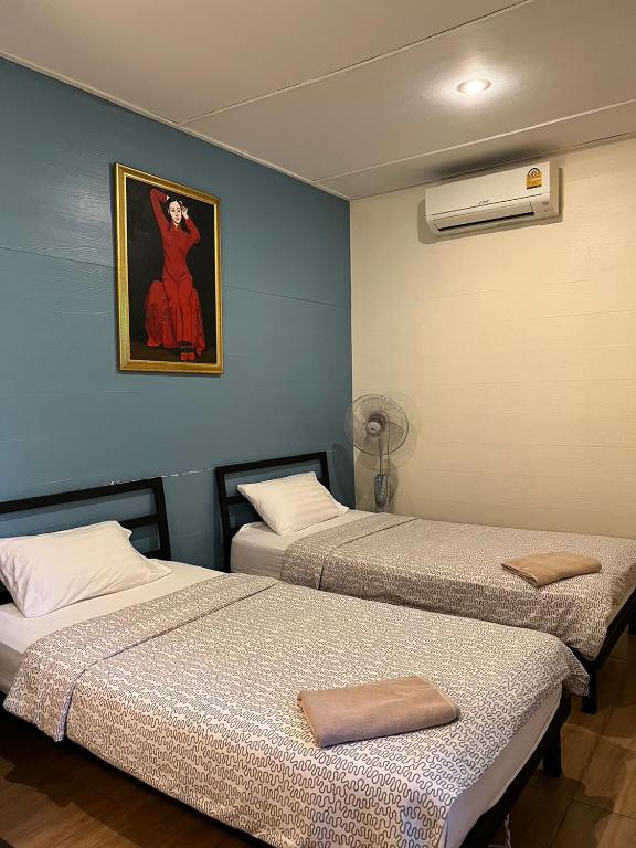 Postel nebo postele na pokoji v ubytování Blue Chang House