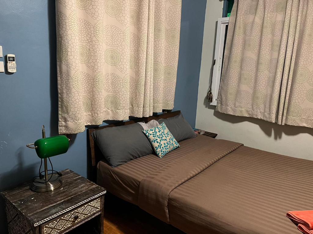 Postel nebo postele na pokoji v ubytování Blue Chang House