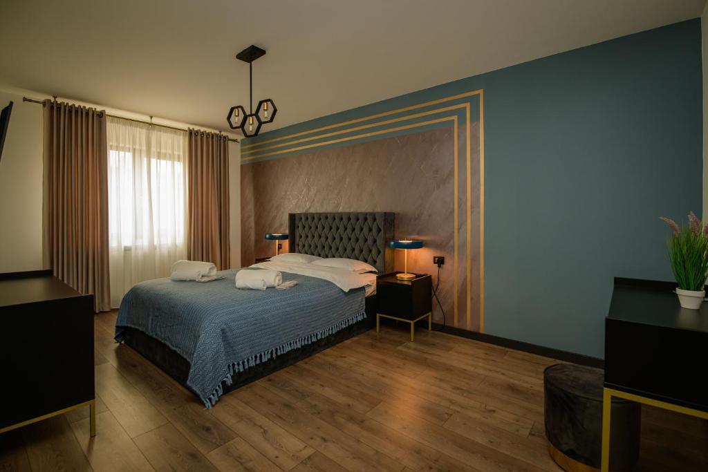 Postel nebo postele na pokoji v ubytování Casa Lucan Brașov