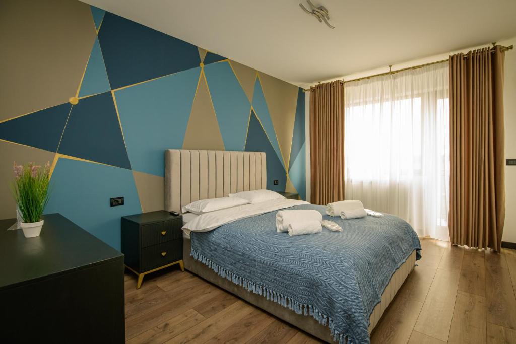 Postel nebo postele na pokoji v ubytování Casa Lucan Brașov