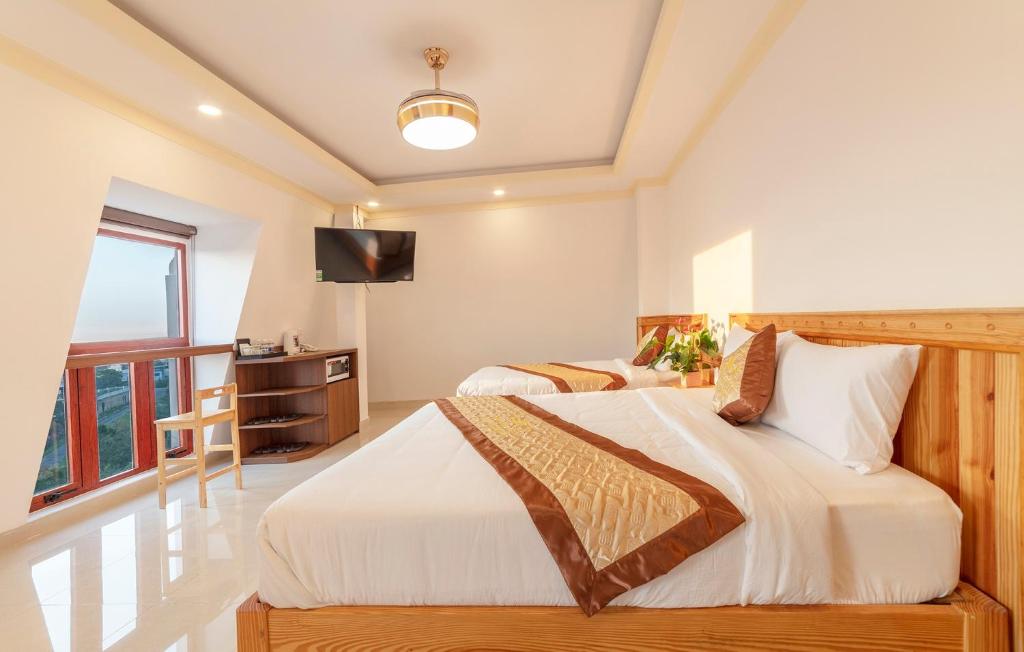 Giường trong phòng chung tại Hoàng Yến Villa Dalat