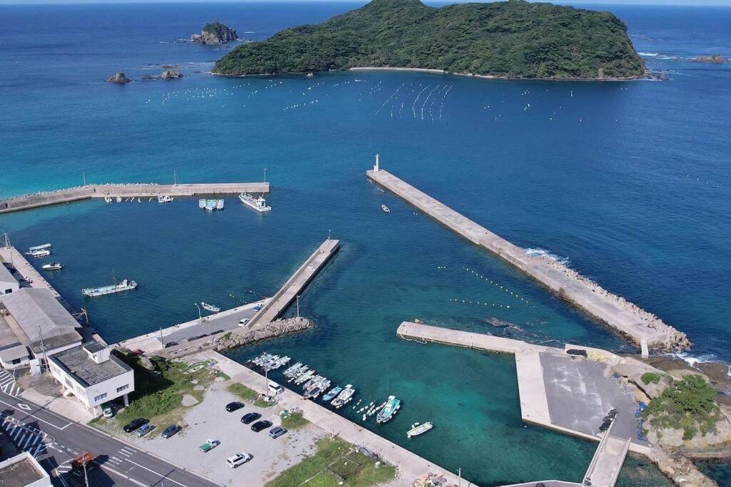 an aerial view of a harbor with boats in the water at 一棟貸し別荘つる in Matsue