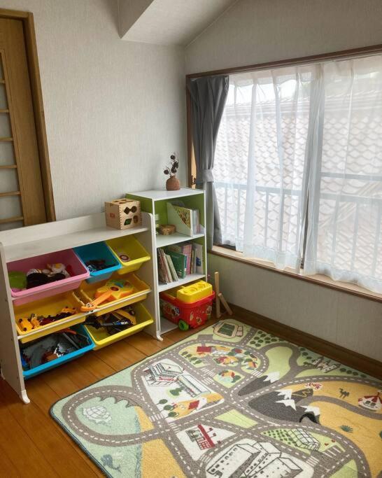 Een bed of bedden in een kamer bij 一棟貸し別荘つる