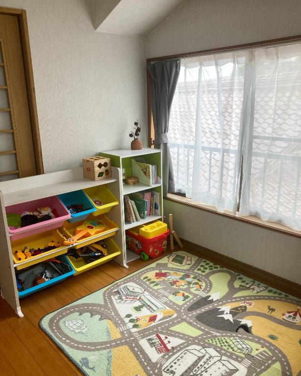 Een bed of bedden in een kamer bij 一棟貸し別荘つる