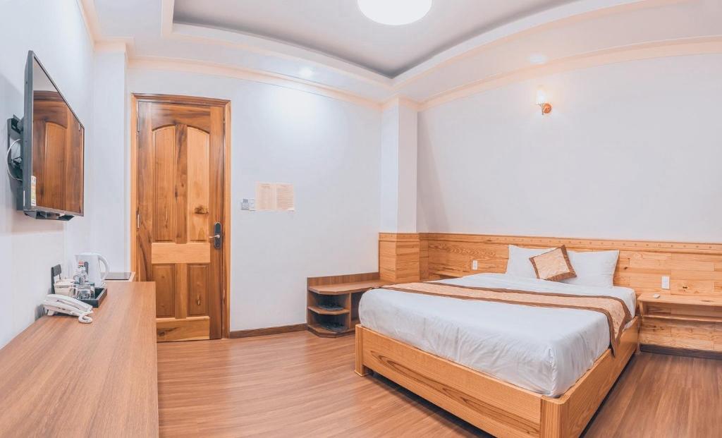 Giường trong phòng chung tại Hoàng Yến Villa Dalat