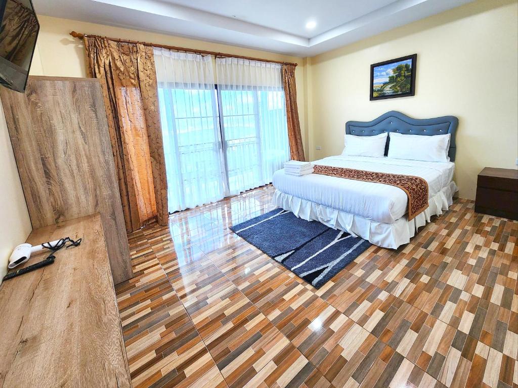 Postel nebo postele na pokoji v ubytování So View Phuket Resort