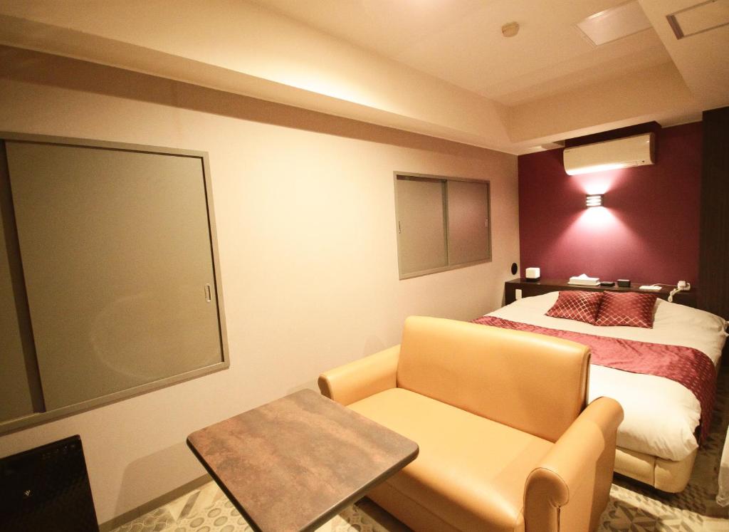 Postel nebo postele na pokoji v ubytování Hotel RIO新宿