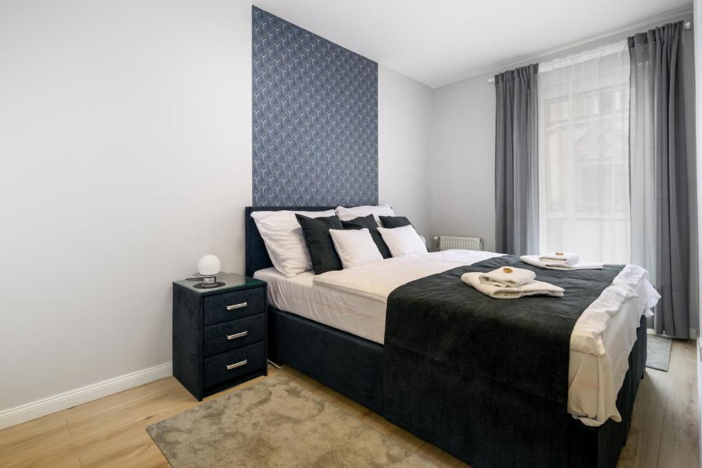 Posteľ alebo postele v izbe v ubytovaní Bence Apartman Budapest (District VII)