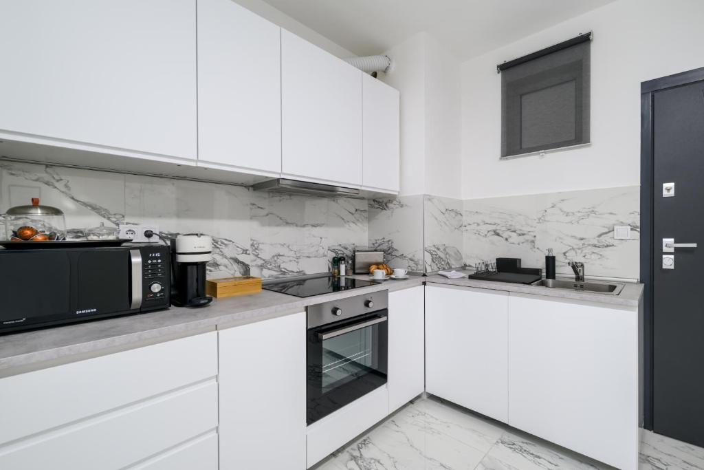 Kuchyňa alebo kuchynka v ubytovaní Bence Apartman Budapest (District VII)