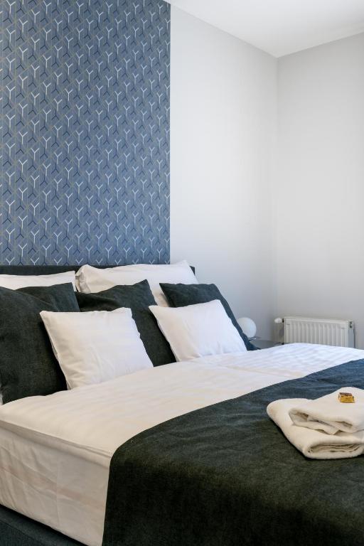 Posteľ alebo postele v izbe v ubytovaní Bence Apartman Budapest (District VII)