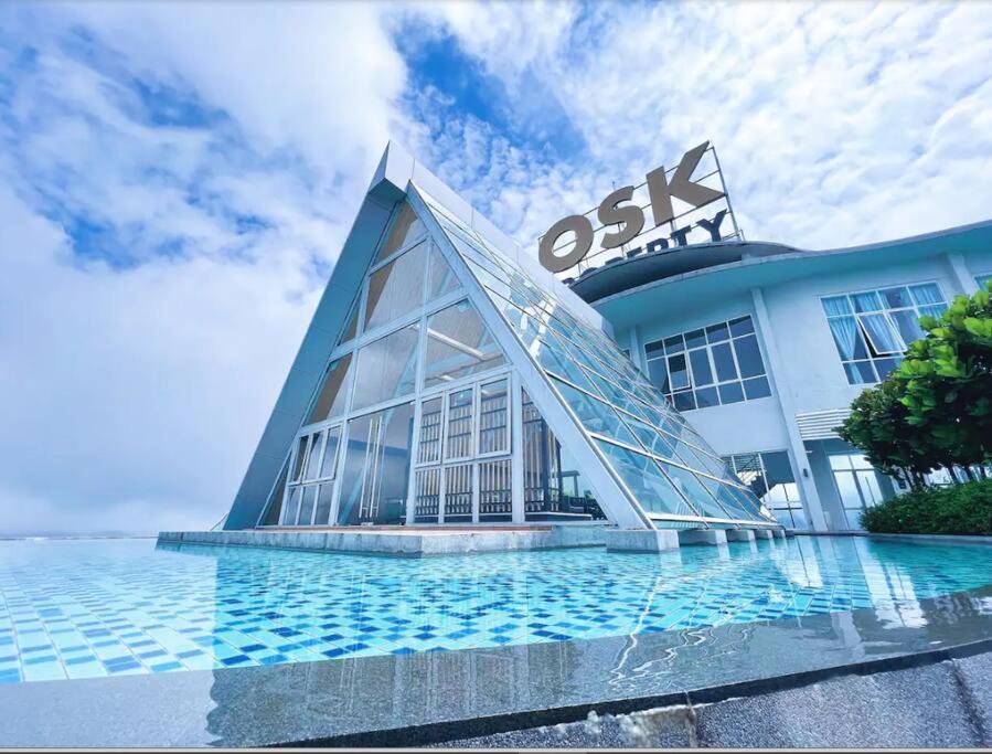 a building with a pyramid shaped facade with water at Windmill Upon Hills, Genting Highlands 2 King bed & 2 free car park in Genting Highlands