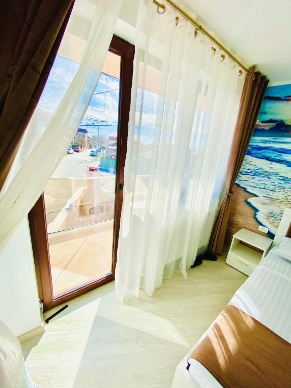Postel nebo postele na pokoji v ubytování IANIS Rooms
