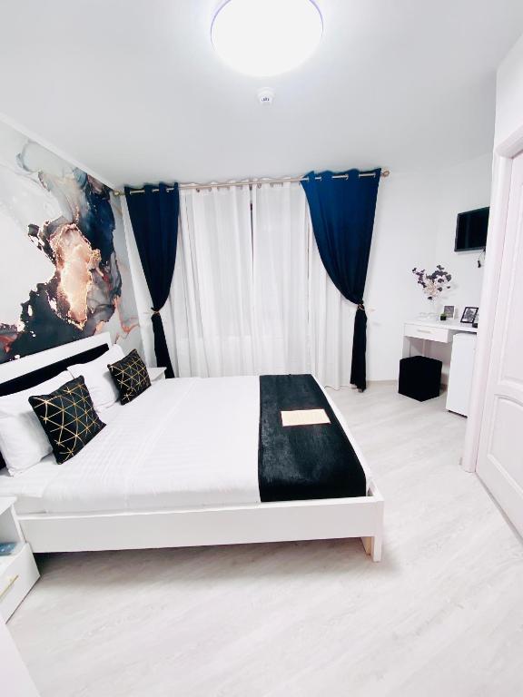 Postel nebo postele na pokoji v ubytování IANIS Rooms