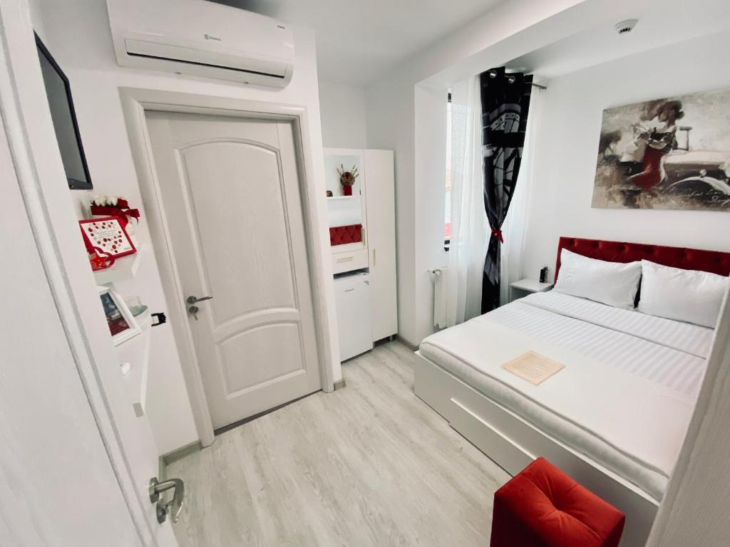 Postel nebo postele na pokoji v ubytování IANIS Rooms