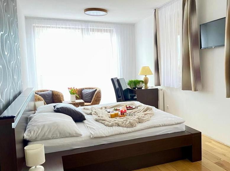 Postel nebo postele na pokoji v ubytování Archa restaurant a penzion