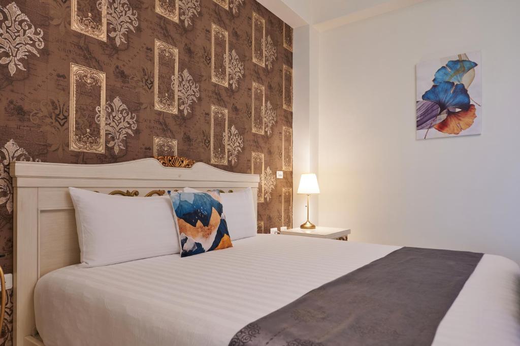 Postel nebo postele na pokoji v ubytování Avenue B&B