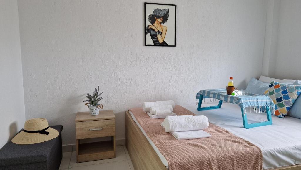 Postel nebo postele na pokoji v ubytování Afros Lux Studios 201