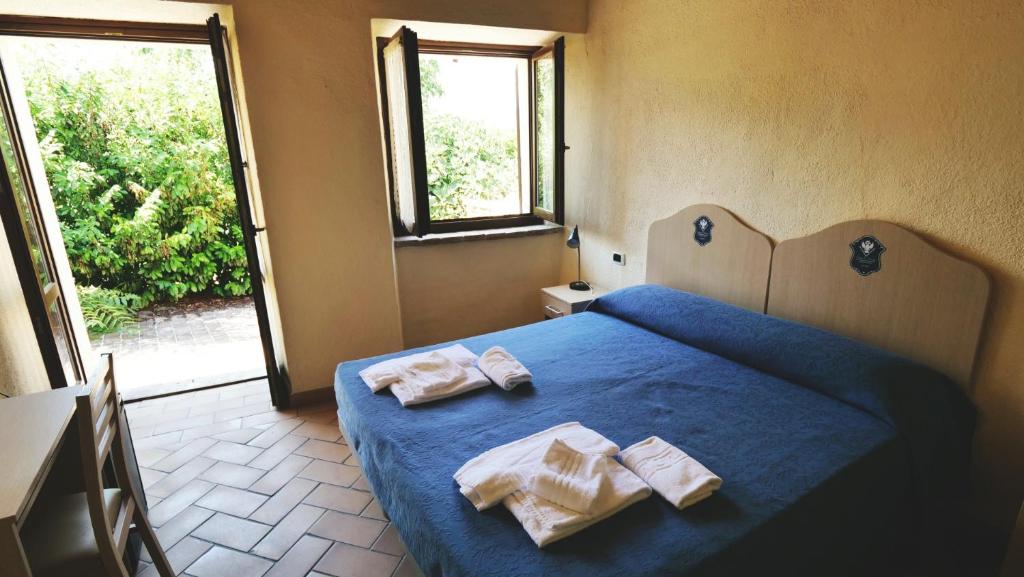 Postel nebo postele na pokoji v ubytování Borgo de' Varano by Hotel I Duchi