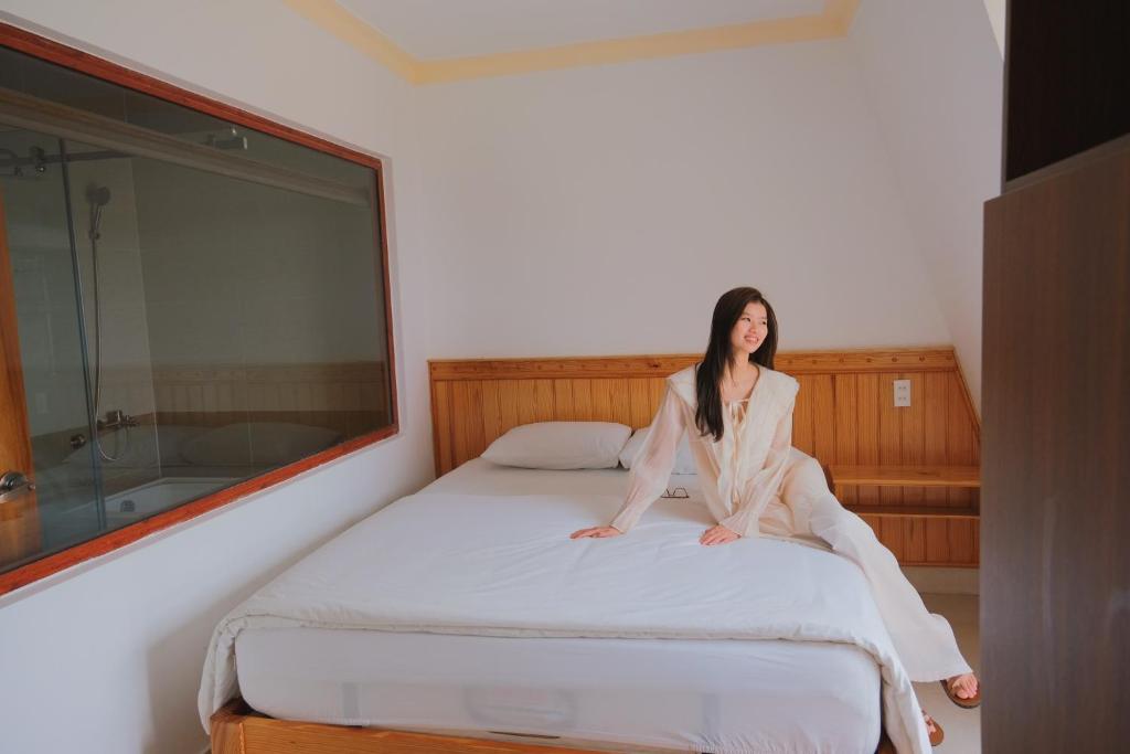 Giường trong phòng chung tại Hoàng Yến Villa Dalat