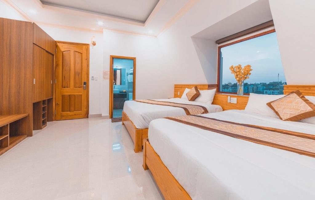 Giường trong phòng chung tại Hoàng Yến Villa Dalat