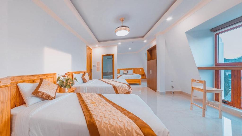 Giường trong phòng chung tại Hoàng Yến Villa Dalat