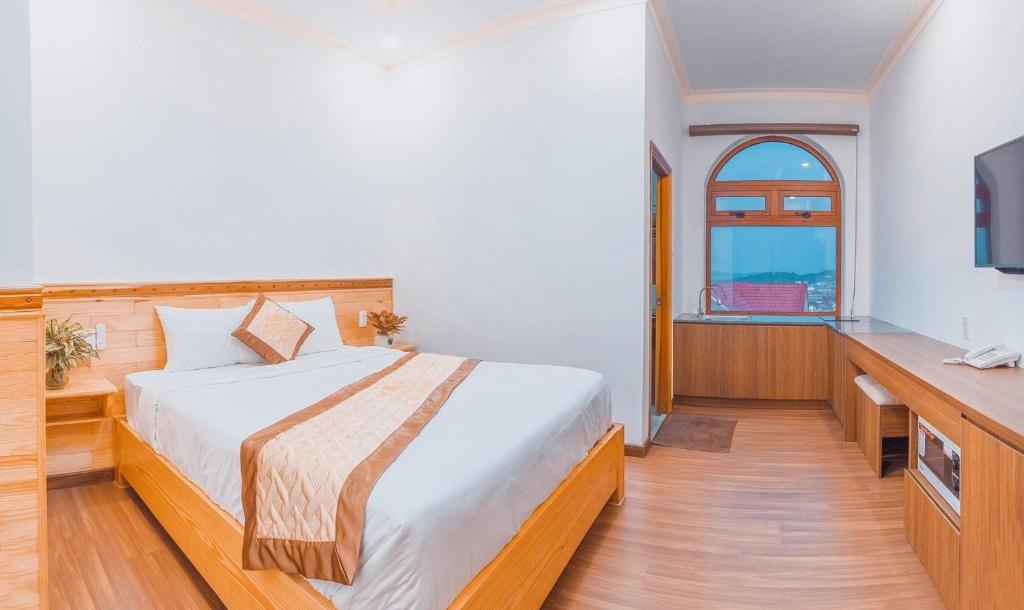 Giường trong phòng chung tại Hoàng Yến Villa Dalat