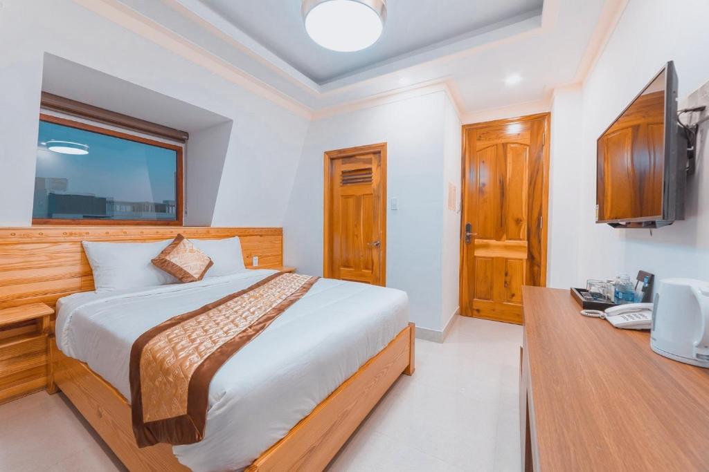 Giường trong phòng chung tại Hoàng Yến Villa Dalat