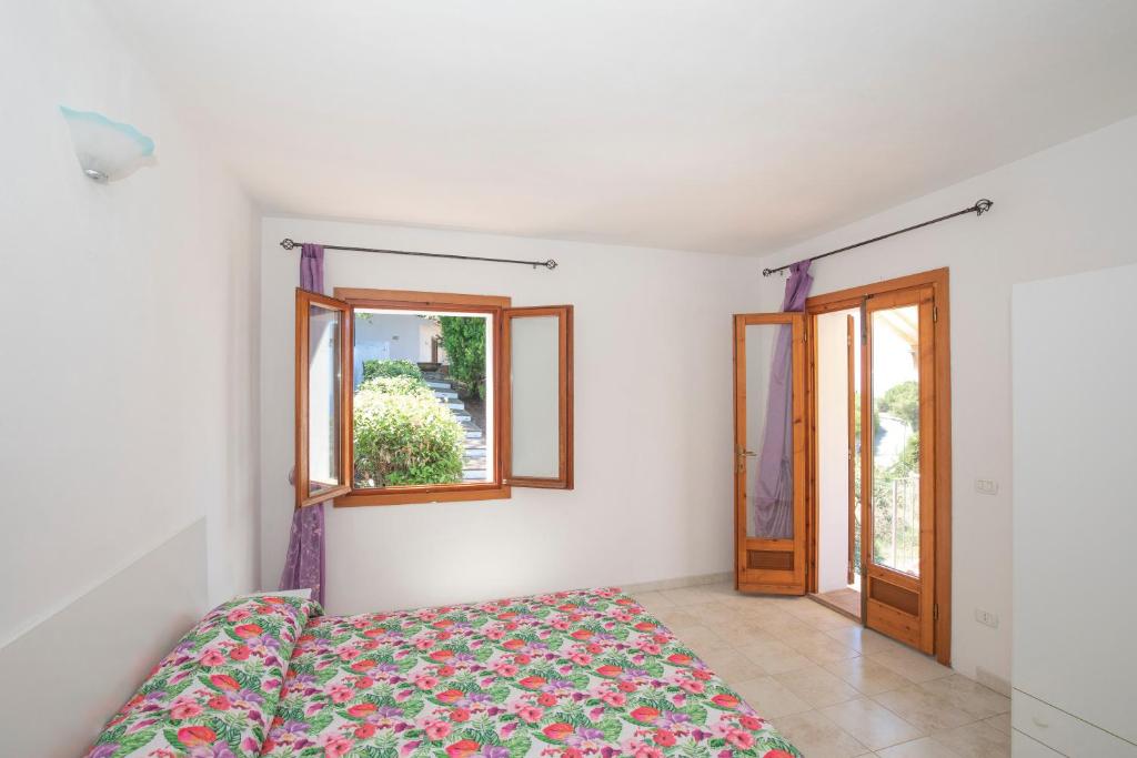 Postel nebo postele na pokoji v ubytování Residenza Miramare - HelloElba