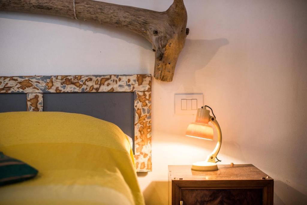 A bed or beds in a room at Il Botteghino