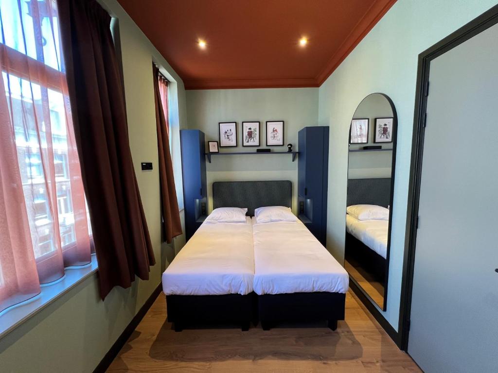 Postel nebo postele na pokoji v ubytování Hotel Nicolaas Witsen