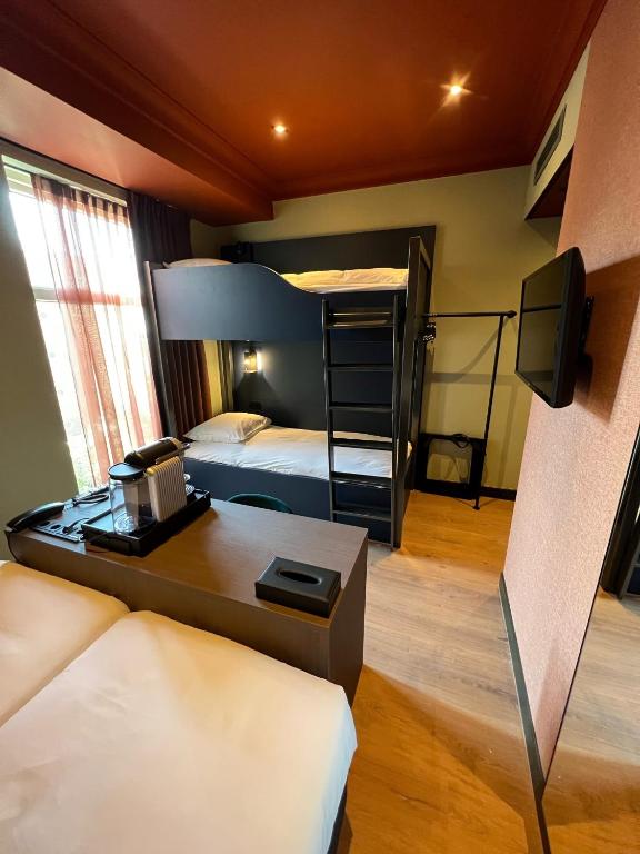 Postel nebo postele na pokoji v ubytování Hotel Nicolaas Witsen