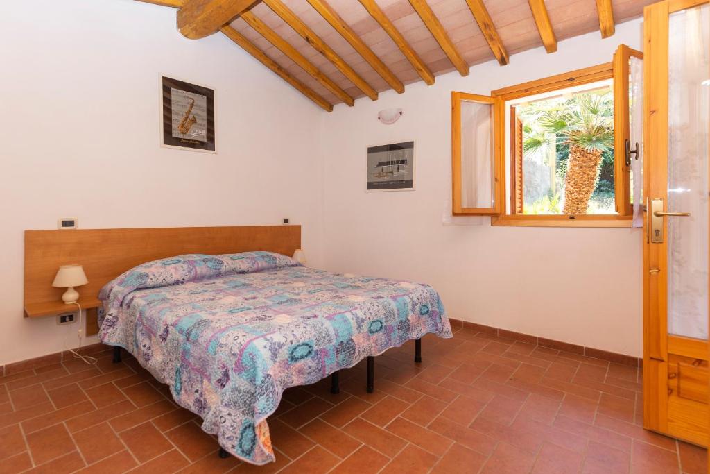 Postel nebo postele na pokoji v ubytování Residenza Miramare - HelloElba