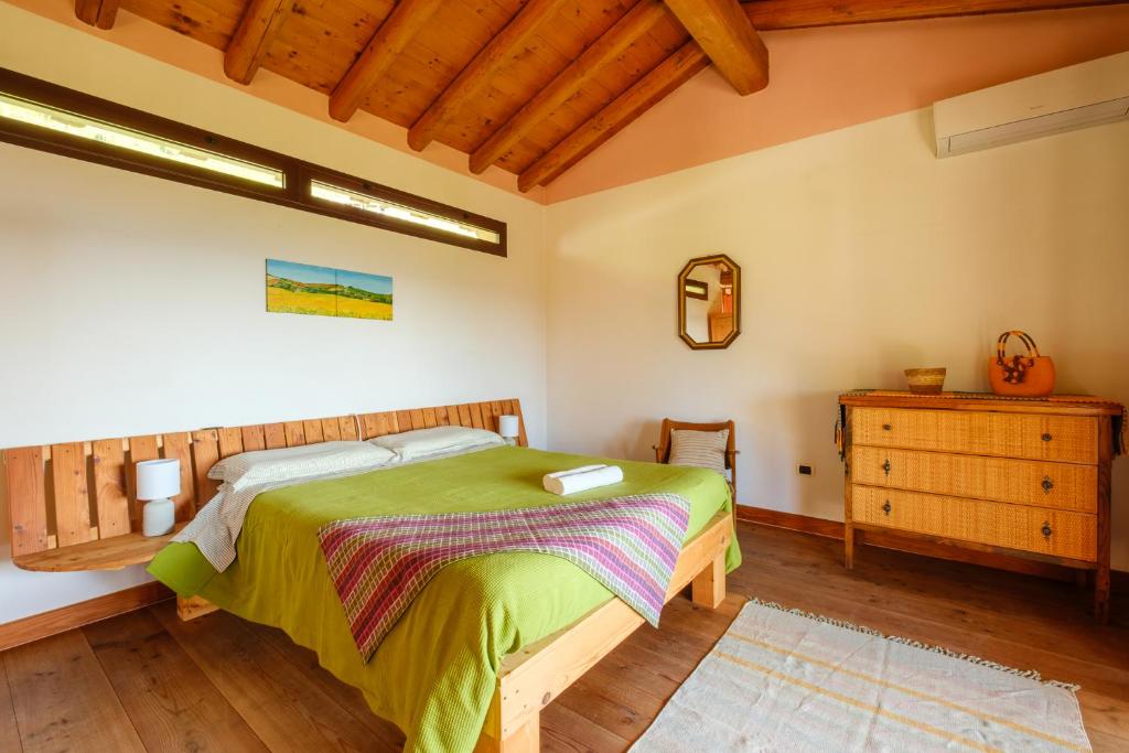 Postel nebo postele na pokoji v ubytování Le Vigne Panoramiche