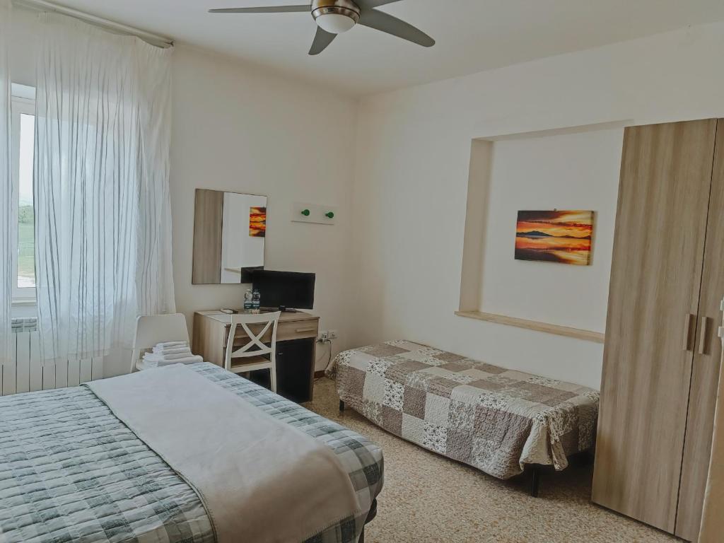 Katil atau katil-katil dalam bilik di Locanda Zona Franca