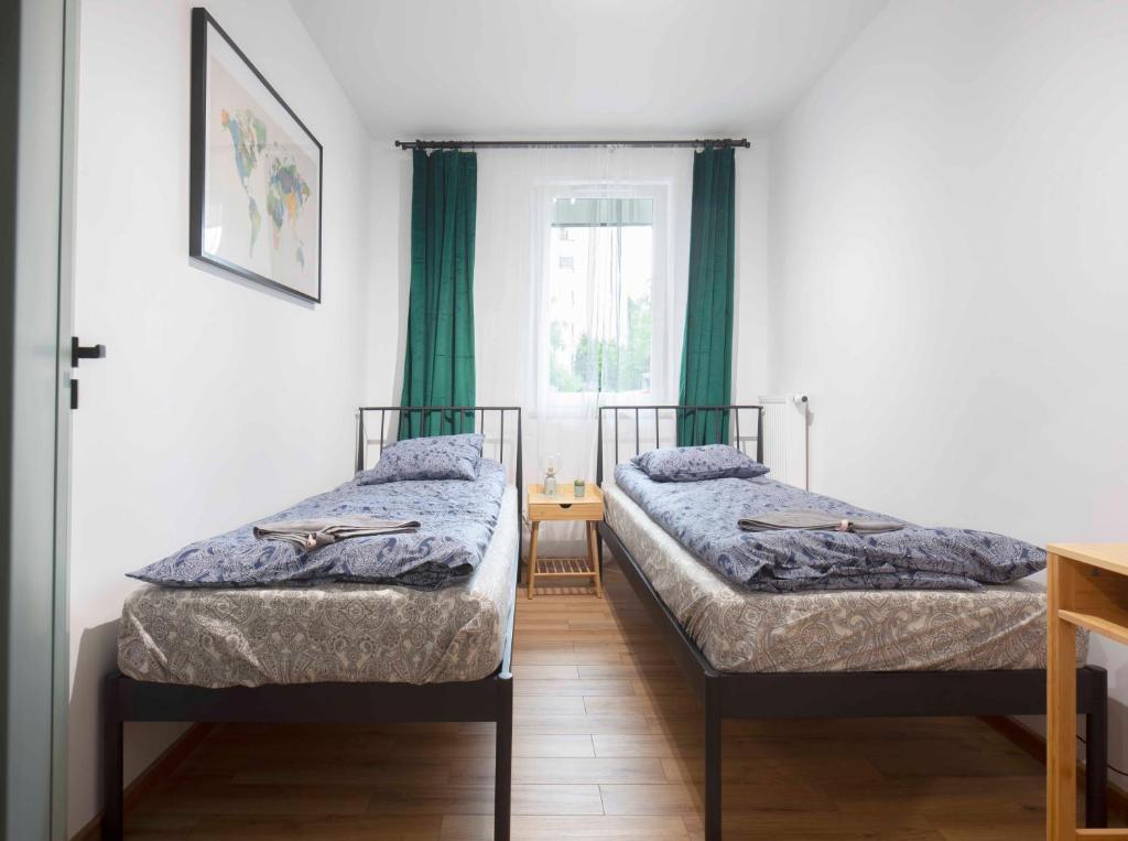 Postel nebo postele na pokoji v ubytování WAW Apartament Ursynow