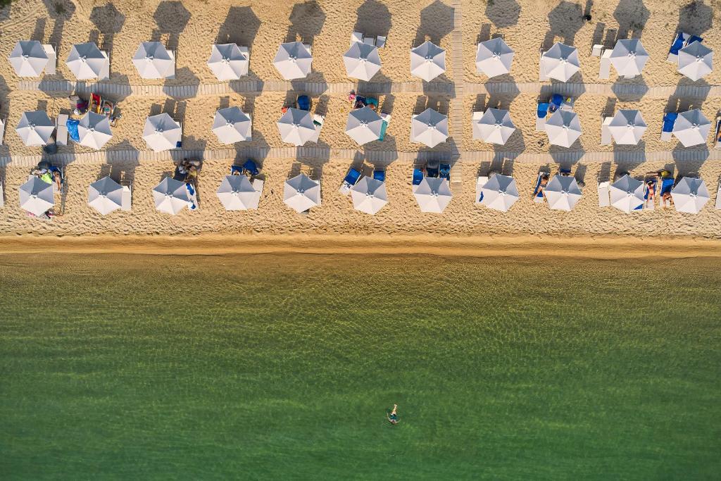 an overhead view of a beach with a group of chairs at Akti Toroni Boutique Hotel in Toroni